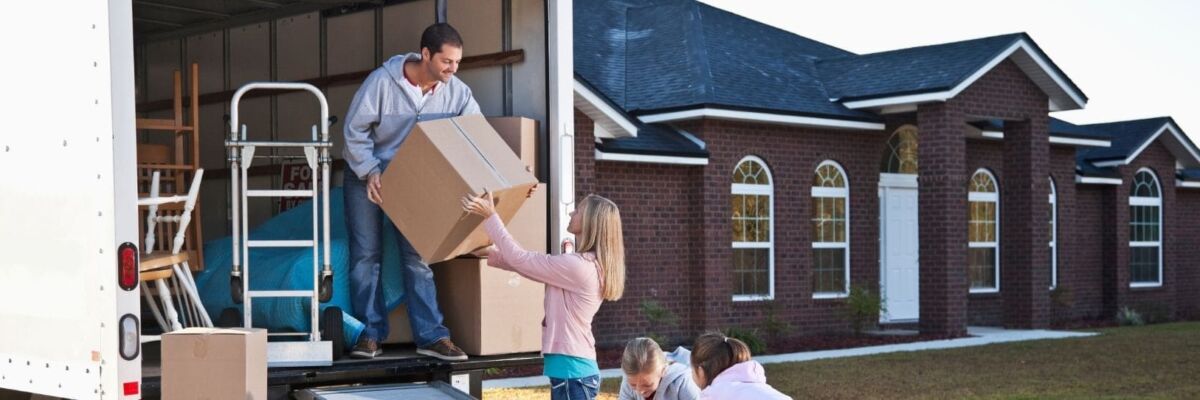 Happy family moving at back-to-school time